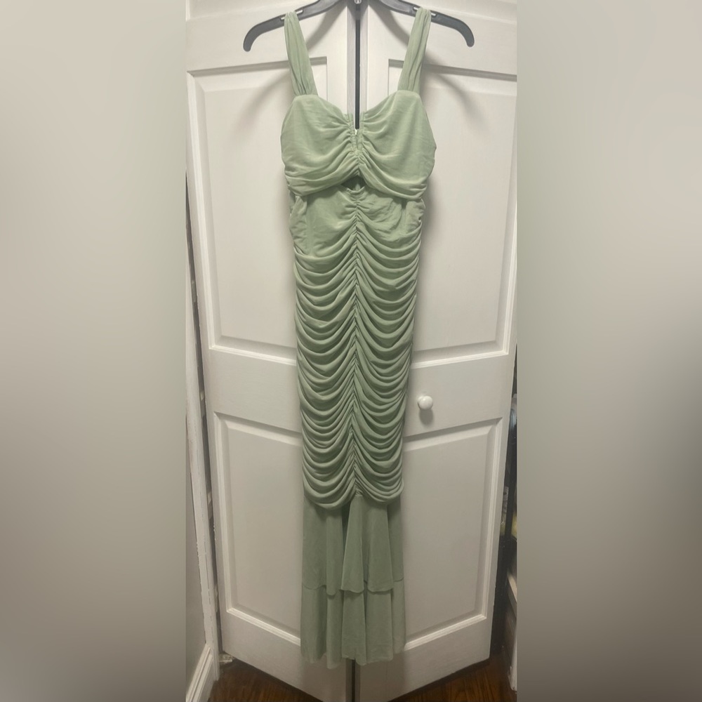 Ankle length sage green dress. Form fitting. Size medium.
